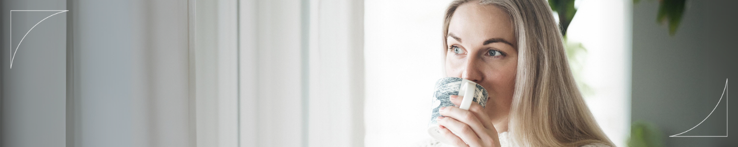 Picture of a person living with a severe disease drinking a cup of coffee