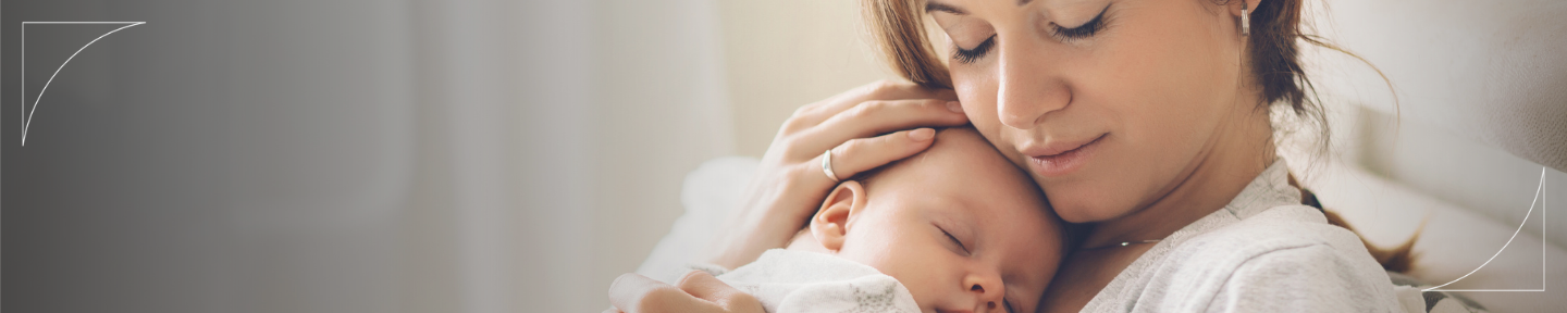 Picture of a woman holding a newborn in her arms